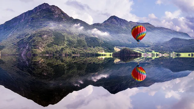 Hot Air Balloon Flying Over Mountains 4K wallpaper