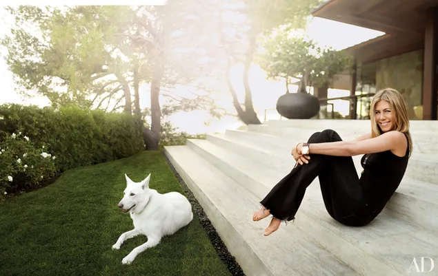 Jennifer Aniston in the front porch with her white dog