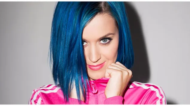 Kate Perry with a blue hair style, colorful eyes and a pink dress