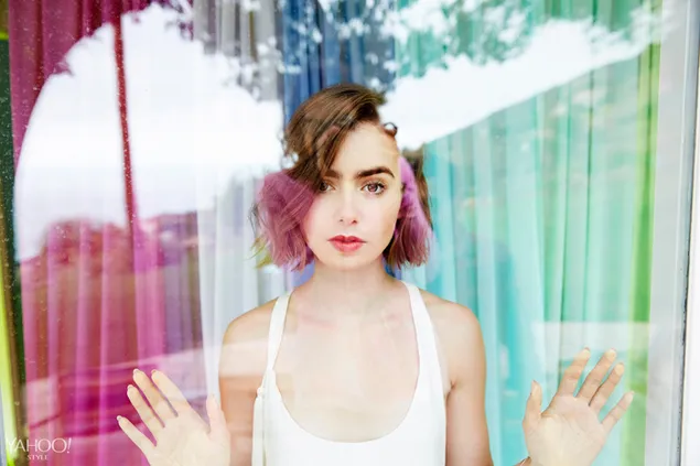 Lily Collins reflection in a glass wall with colorful curtains as background 4K wallpaper
