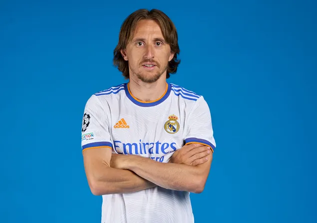 Luka Modric, Croatian national football player of Real Madrid, clasped his hands in front of a blue background