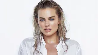margot robbie soft studio portrait with wet hair and minimal white styling