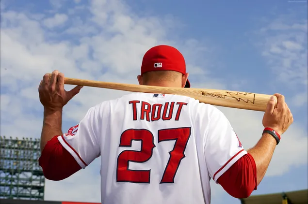 Mike Trout rests his baseball bat on the back of his nape and holds it in his hands