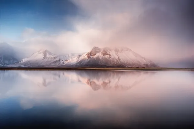 Misty snowy hills reflected in the lake 6K wallpaper