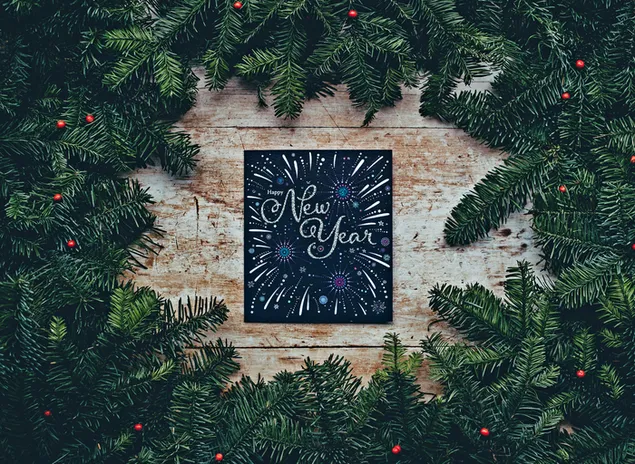 Kartu tahun baru dikelilingi dengan dekorasi daun 4K wallpaper