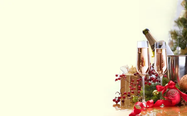 New year preparation gifts and drinking glasses near pine tree on white background download