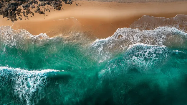 vista aerea del oceano encontrandose con la costa descargar