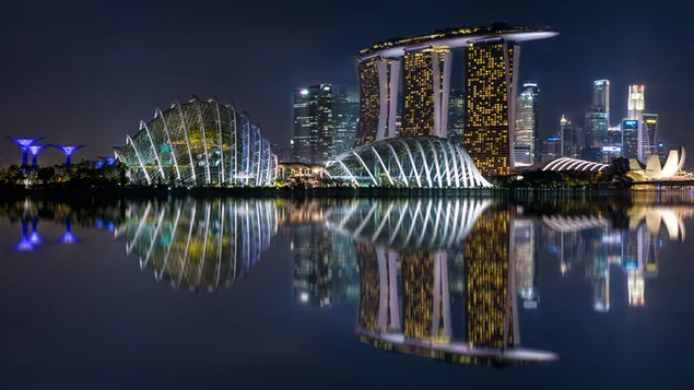 Photo of marina bay sands with the wonderful city lights reflected in the water of the view