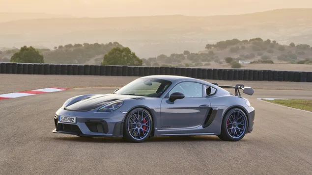 porsche 718 cayman gt4 rs voor- en zijaanzicht op het circuit download