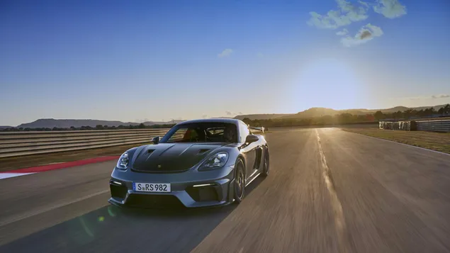 Porsche 718 Cayman GT4 RS front view and sunset download