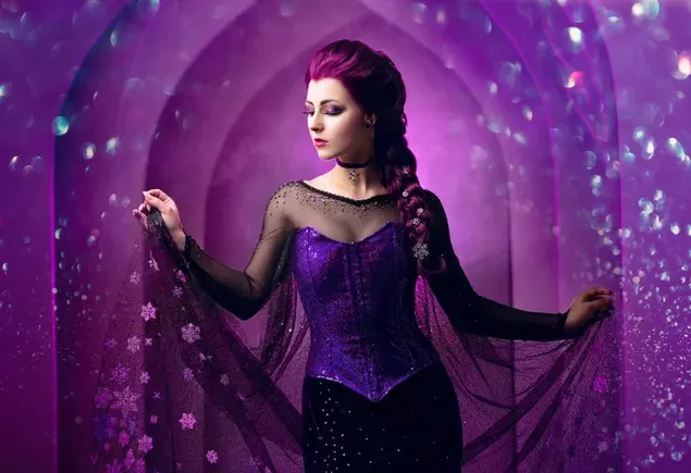 Pose of beautiful woman with purple hair and purple dress in front of purple background