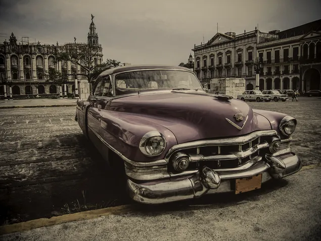 Purple classic car parked in front of building download