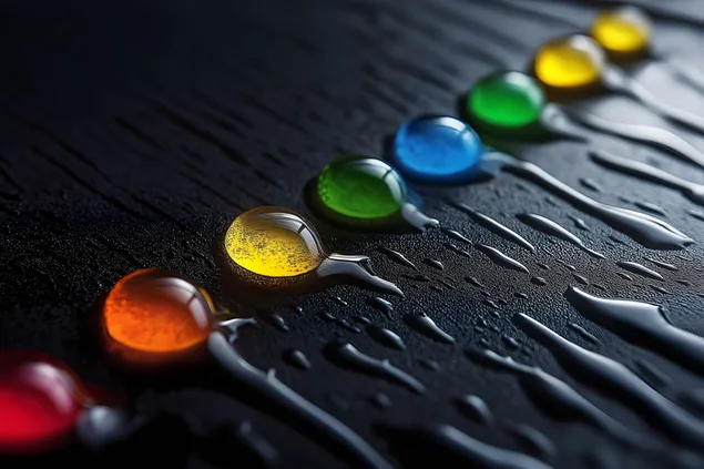 Gotes d'aigua multicolors radiants que brillen sobre una superfície fosca i elegant 2K fons de pantalla
