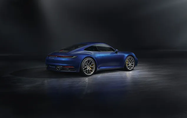 Tampilan belakang Porsche biru di area gelap unduhan
