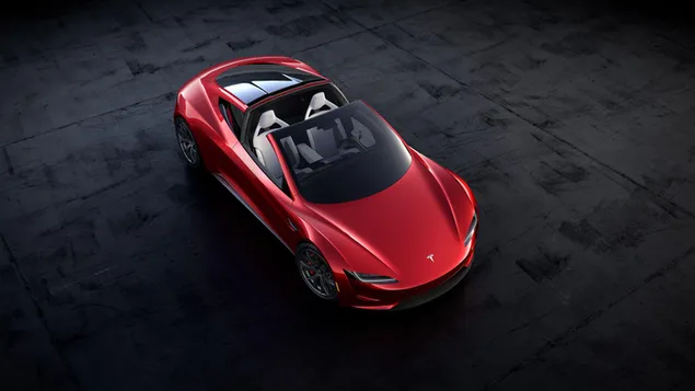 Descapotable rojo Tesla Roadster en la carretera descargar