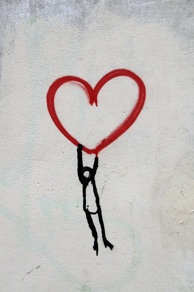 Rotes Herz und Mann hängende Zeichnung