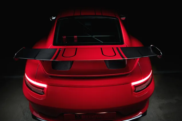 Red Porsche sports car tail lights 2K wallpaper