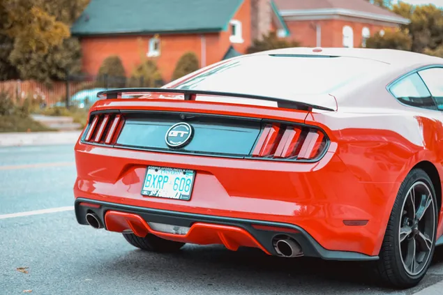 Red sport Ford mustang GT on the road