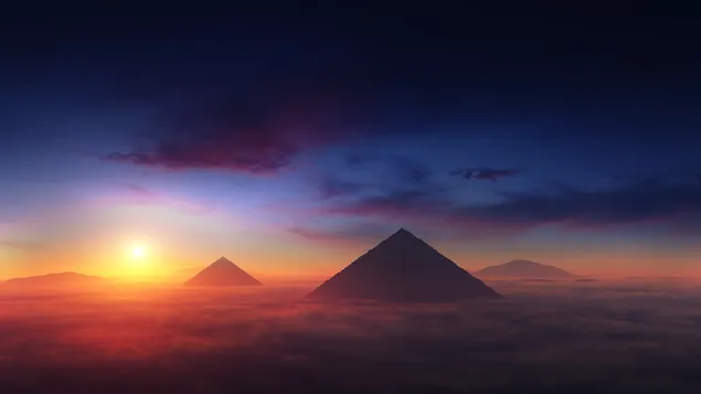 日の出の曇り空の景色と砂漠のピラミッド