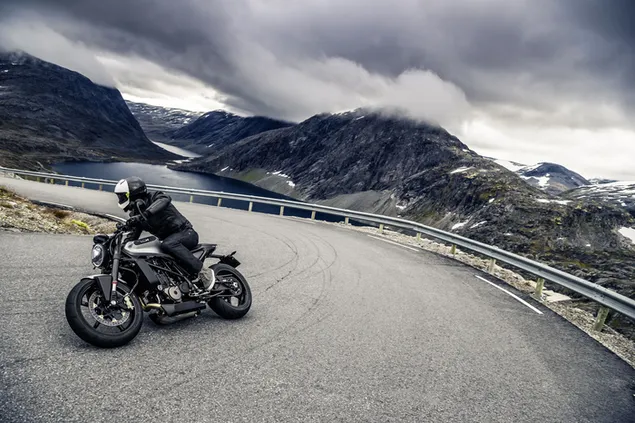 Rider wearing black ranger equipment with helmet on black motorcycle driving 4K wallpaper