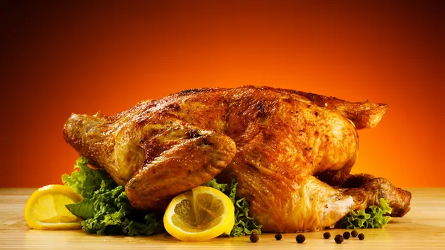 Pollo entero asado con limón, pimienta negra y hierbas descargar