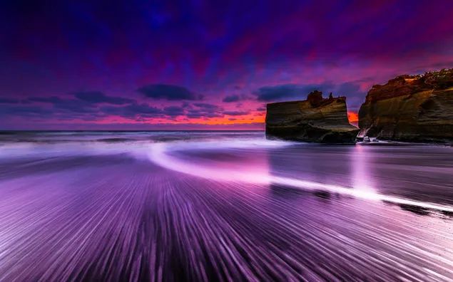 Felsiger Strand-Sonnenuntergang 4K Hintergrundbild