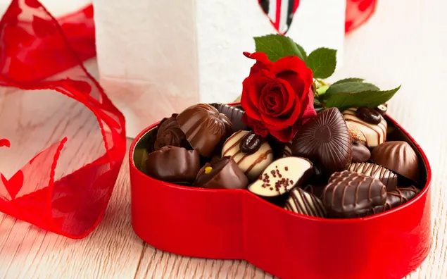 赤いギフトボックスで幸せなチョコレートの日のために準備された茶色と白のチョコレートのバラ