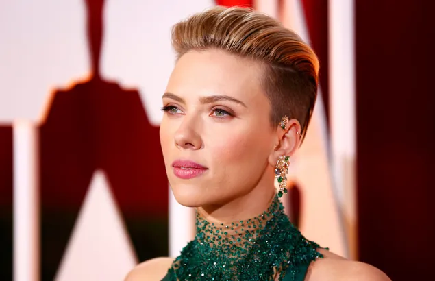 Scarlett johansson in a green outfit with her short blonde hair pulled back