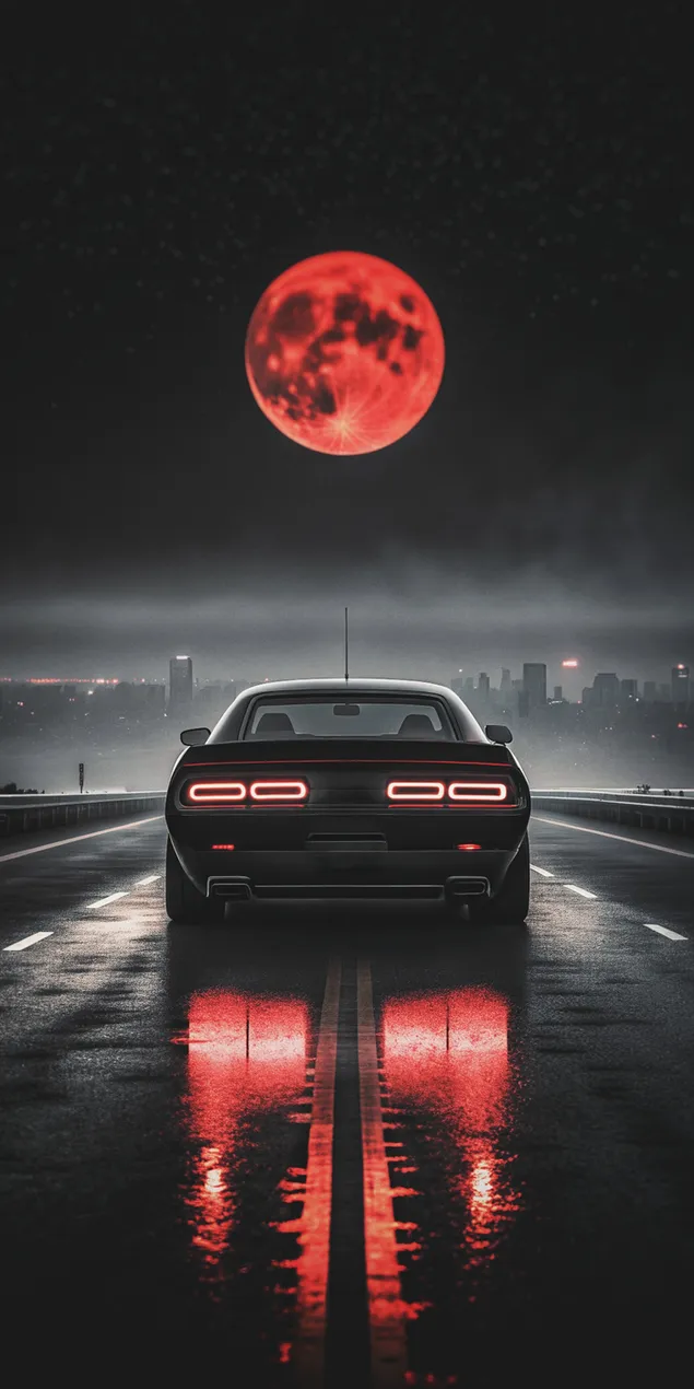 elegantni sportovni vuz pod krvavym mesicem odrazejicim se na mokrem asfaltu stahnout