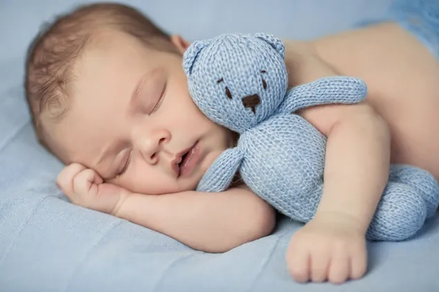 Sleeping baby with toy 4K wallpaper