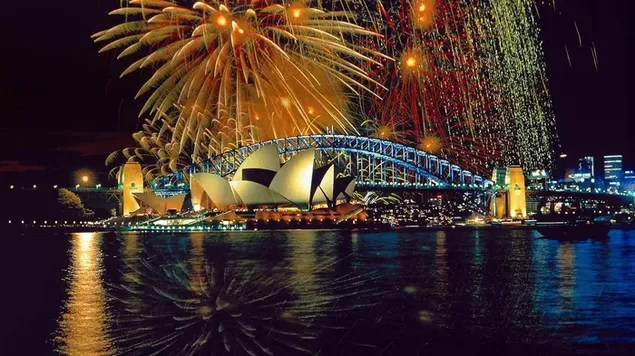 Pemandangan spektakuler Jembatan Pelabuhan Sydney dan Gedung Opera Sydney di New South Wales dan kembang api berwarna-warni di latar belakang 2K wallpaper