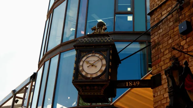 Street Clock in one of the Buildings in London  4K wallpaper