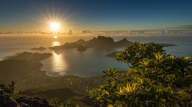 amanecer sobre montanas tropicales y oceano resplandeciente descargar