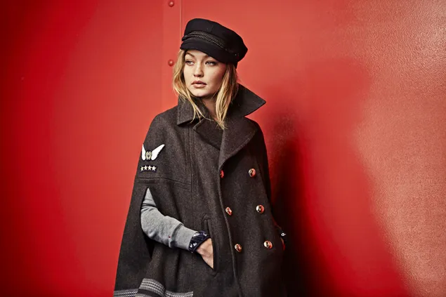 Super fashion model Gigi Hadid wearing long black coat and hat