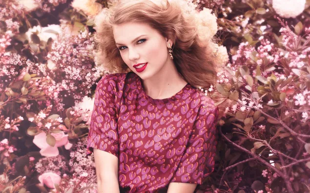 Taylor Swift sitting among the flowers 2K wallpaper