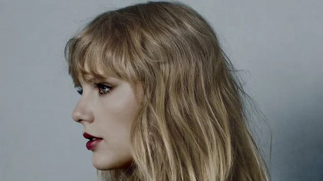 Taylor Swift met blauwe ogen, rode lippenstift en warrig blond haar download