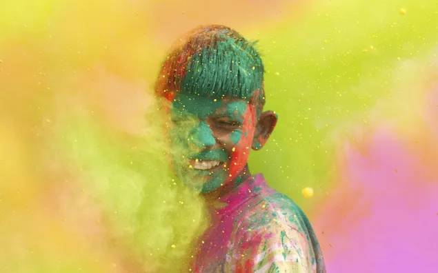 The boy fully covered with Holi beautiful colours 2K wallpaper