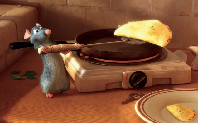 The cook mouse from the animated movie ratatouille cooks an omelet