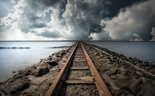 The railway from the middle of the sea to the majestic clouds 2K wallpaper