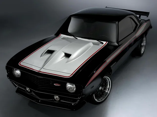 Chevrolet camaro yang memberontak dalam desain warna hitam dan putih yang menarik unduhan
