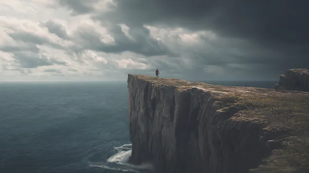 Utazó egy zord sziklán, ahonnan hatalmas óceáni kiterjedésekre nyílik kilátás 2K háttérkép