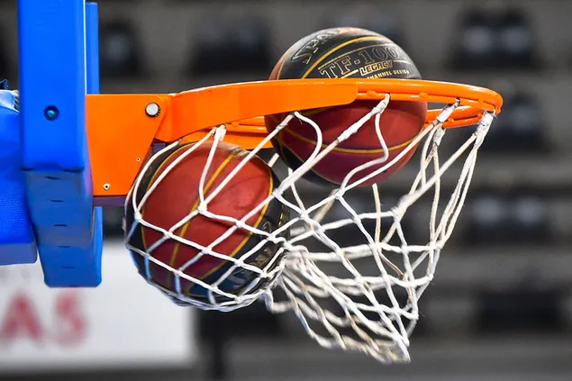 Two balls falling through a Basketball Hoop download