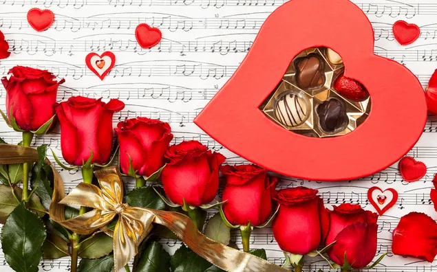 Valentinstag - Pralinen und schöne rote Rosen 2K Hintergrundbild