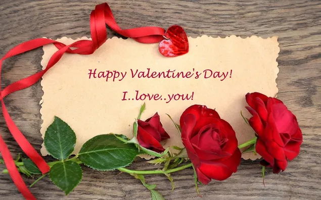 Valentinstag-Glückwunsch-Schriftzug zwischen roten Rosen herunterladen