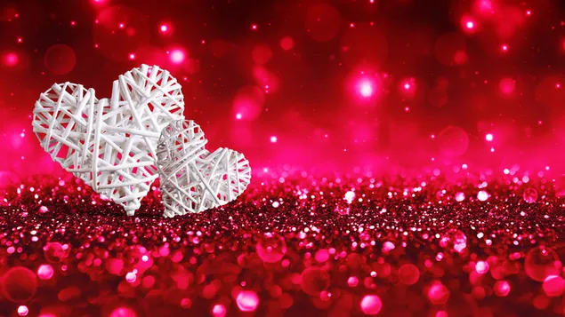 Día de san valentín: pares de corazones con luces bokeh rosas