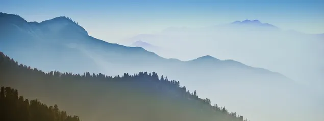 vast mountains overlapping each other with mist download