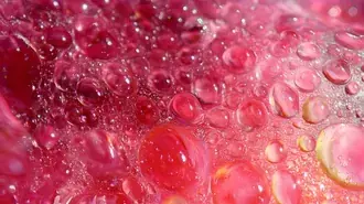 Vibrant Bubble World: Macro View of Red Liquid Droplets 8K wallpaper