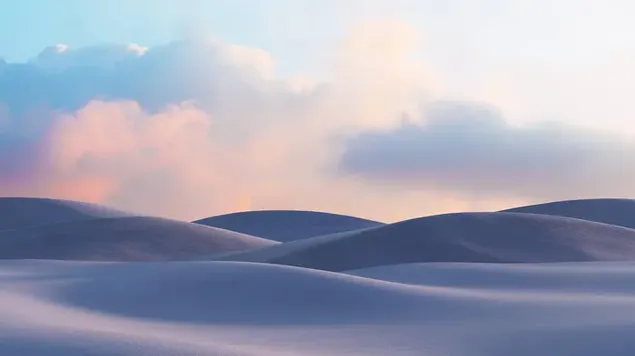 Uitzicht op de duinen die zich uitstrekken tot in de wolken