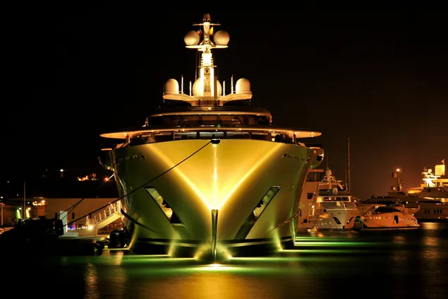 White and brown yatch with lights at night download