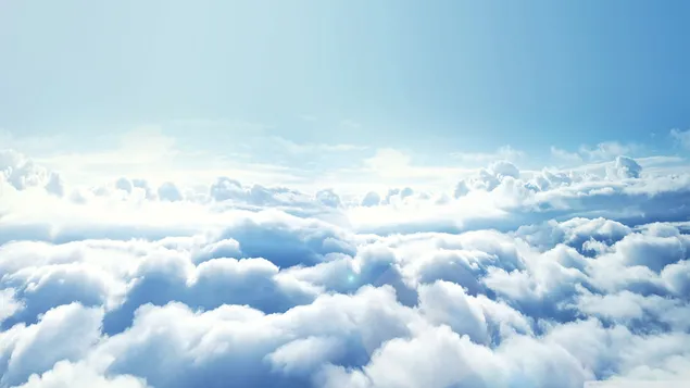 Nuvole bianche che sembrano aver nevicato nel paesaggio sopra le nuvole 2K sfondo